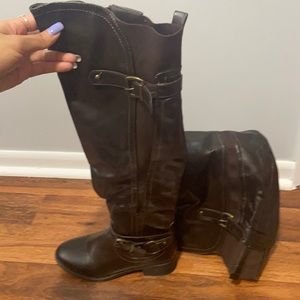 Dark brown over the knee boot.